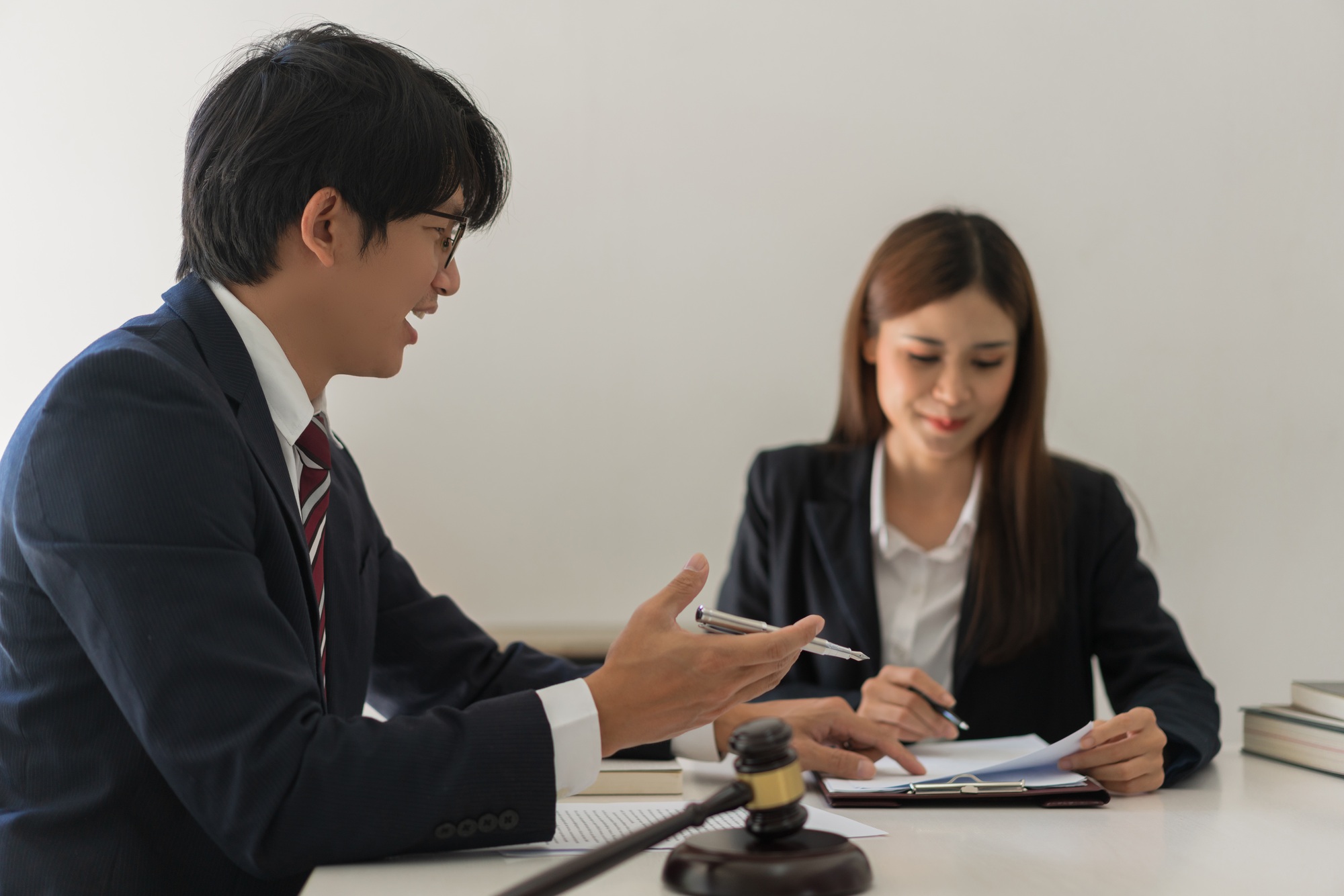 Law and justice concept, Male lawyer explains contract about regulation to consultant in law firm